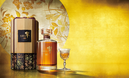 A bottle of Hibiki 40 Year Old sits in between the external box and a small dram